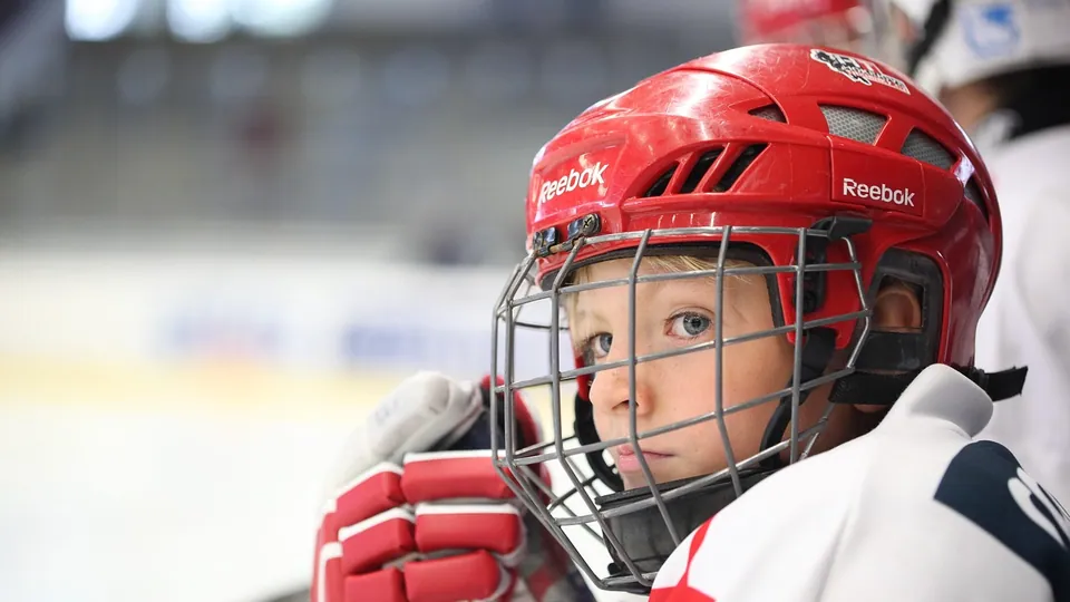 An ice hockey player with the puck