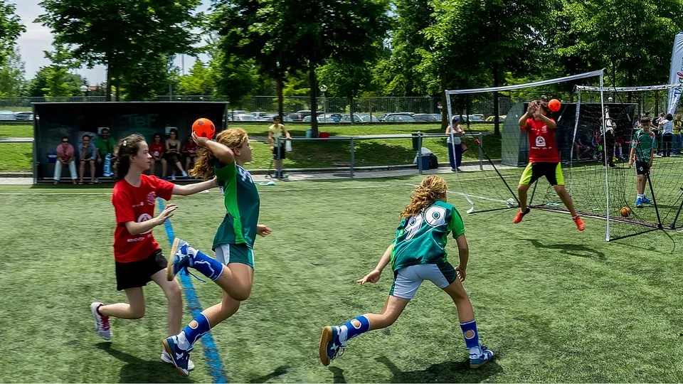 Young players in an outdoor handball game